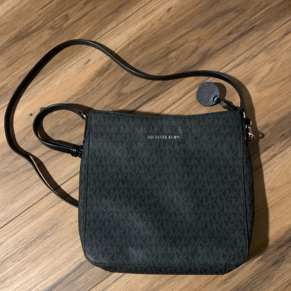 Michael Kors Black Messenger Bag with Adjustable Strap and Zip Closure